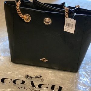 🆕 Coach black pebble turnlock tote.